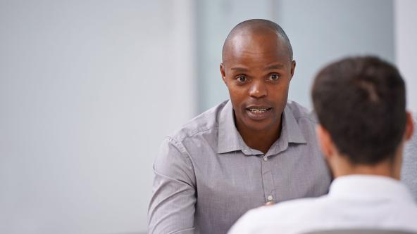 Two office workers having a meeting.